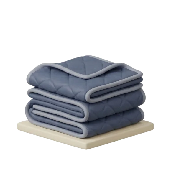 Folded moving blankets used to protect furniture during transport.