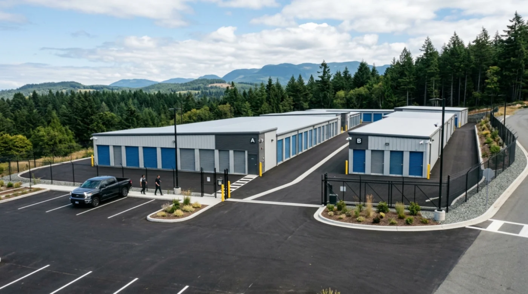 Aerial view of a modern Nanaimo self-storage facility with secure blue-door units and mountain backdrop
